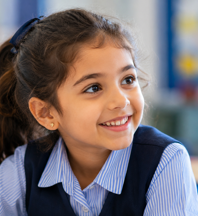 Smiling student in school uniform