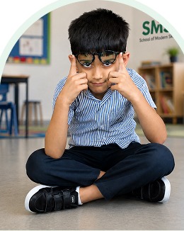 Elementary student making a thinking gesture