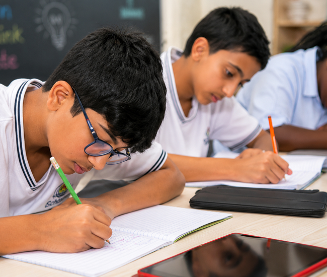 Boys Division students writing during class at School of Modern Skills