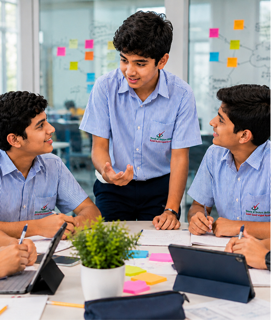 Boys Division student leading a group discussion with classmates